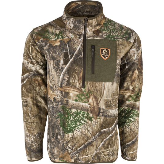 A camouflage jacket with a zipper, perfect for big game hunters. Made of plush 200 gram fleece for warmth and moisture-wicking insulation. Final Sale.