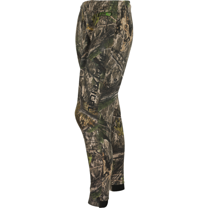 A close-up of the Storm Front Fleece Midweight 4-Way Stretch Pant, featuring a camouflage pattern and logo. Ideal for big game hunters, this warm and moisture-wicking pant is made of 200-gram 4-Way Stretch Fleece. Final Sale.