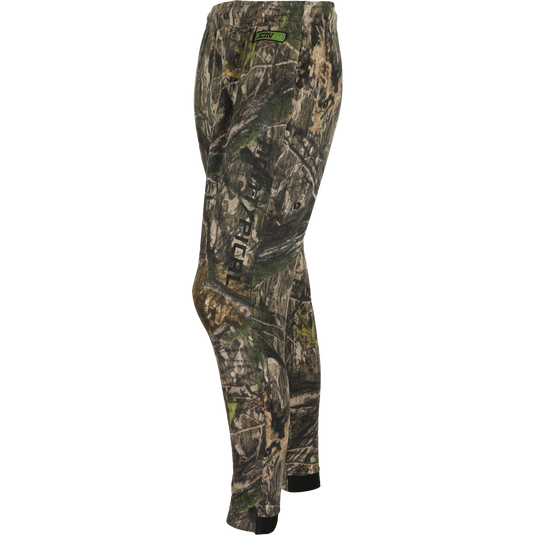 A close-up of the Storm Front Fleece Midweight 4-Way Stretch Pant, featuring a camouflage pattern and logo. Ideal for big game hunters, this warm and moisture-wicking pant is made of 200-gram 4-Way Stretch Fleece. Final Sale.