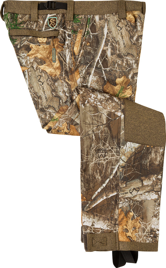 A pair of women's Silencer pants with Agion Active XL technology, featuring camouflage pattern, a deer logo, and a close-up of a belt.