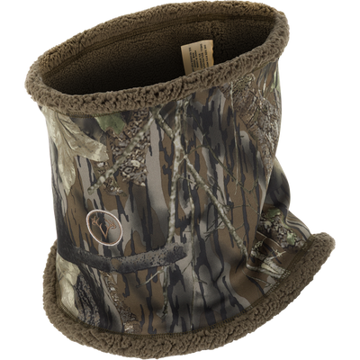 Non-Typical Silencer Sherpa Fleece Neck Gaiter with camo pattern, fleece lining, deer-antler logo, designed for warmth and scent control in harsh hunting conditions.