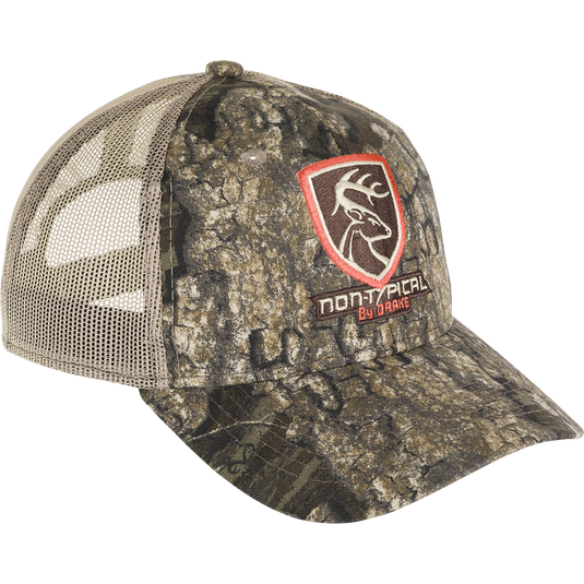 A camouflage hat with the Non-Typical logo on the front. Made with 100% cotton twill and breathable mesh on the back. Rear hook and loop closure.