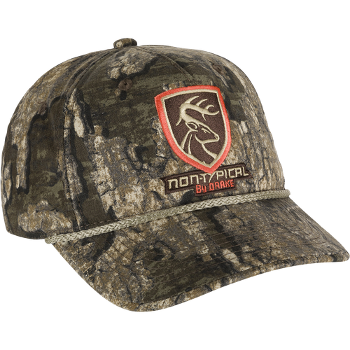 A Non-Typical 5-Panel Cap with camouflage pattern and logo. Made of 100% cotton twill fabric, featuring a structured front panel and adjustable hook & loop closure. Perfect for hunting and outdoor activities.