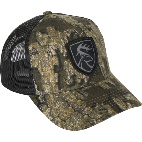 Mesh-Back Patch Logo Cap - Realtree: A camouflage hat with a logo patch featuring a deer head. Made with 100% cotton twill and breathable mesh on the back. Adjustable snap closure.