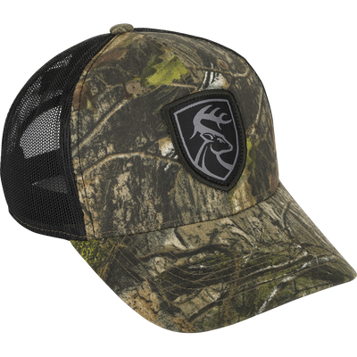 Mesh-Back Patch Logo Cap with black mesh, black and green logo patch, cotton twill front, breathable mesh back, and adjustable snap closure.