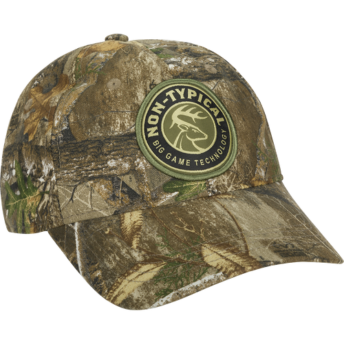 Camo Cotton Twill Patch Cap with Drake logo, featuring full camo concealment and lightweight 60% cotton/40% polyester construction. Six-panel design with snap closure for adjustable fit.