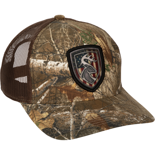 Americana Shield Patch Mesh-Back Cap with deer head and flag patch on cotton twill front panels and breathable mesh back. Adjustable snap closure.