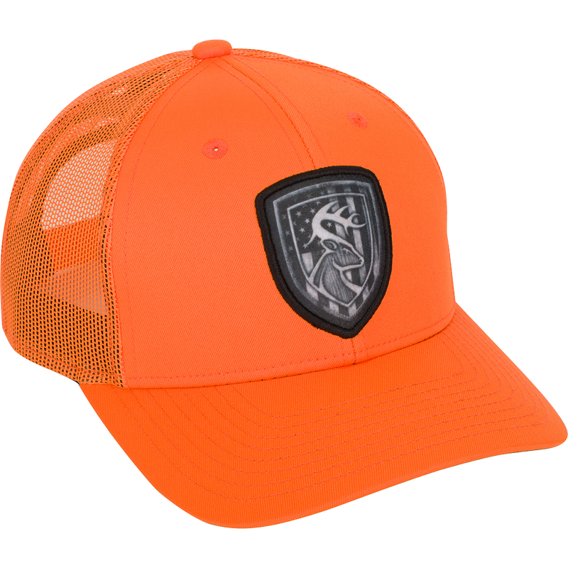 Americana Shield Patch Mesh-Back Cap with logo on front. 100% cotton twill panels and breathable mesh back. Adjustable snap closure.