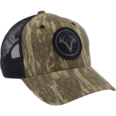 Close-up of the Non-Typical Mesh Back Patch Logo Cap with camo front, black mesh back, embroidered V and antlers patch, and adjustable snapback closure.