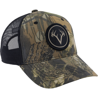 Camouflage-patterned Non-Typical Mesh Back Patch Logo Cap with black mesh back, featuring a deer-antler logo patch and adjustable snapback, perfect for outdoor activities.
