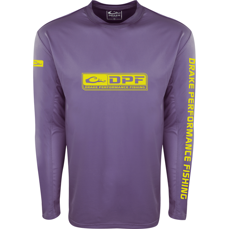 A purple Drake Waterfowl Shield 4 Arched Mesh Back Crew L/S: A purple long-sleeved active shirt with yellow logo, designed for all-day water trips. Features Shield 4™ technology for sun protection and odor control.