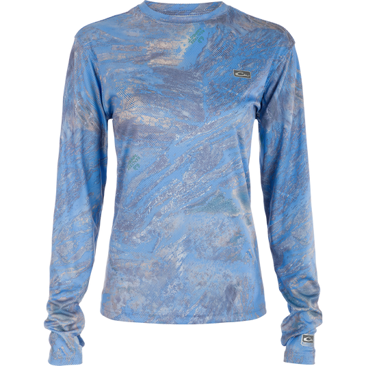 Women's Performance Crew Realtree Aspect Dot, a blue long sleeved shirt with a fish camo pattern and white dot overlay. Lightweight, breathable, and quick drying for all-year wear. Ideal for outdoor activities like fishing and beach trips.