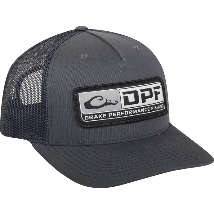 A black trucker cap with a patch and logo, featuring a 5-panel construction and adjustable snapback. Made of 60% cotton / 40% polyester shell with a nylon mesh back. Perfect for hunting, fishing, and casual wear.