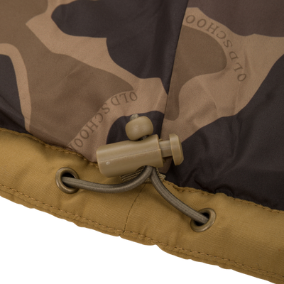 Close-up of Delta Featherless Down Jacket featuring camo-patterned fabric, tan hem, and adjustable paracord with toggle, highlighting its durable design for outdoor activities.