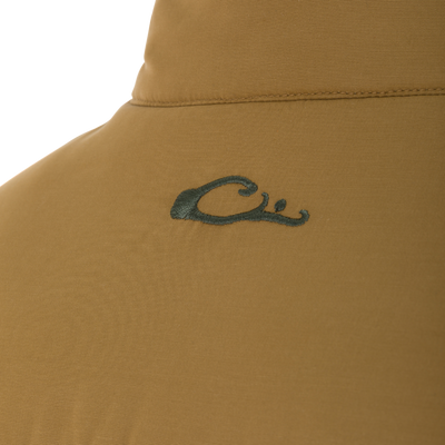 Close-up of the Delta Featherless Down Jacket's khaki fabric, showing a stitched brim and partial green embroidered logo, highlighting its outdoor-focused design and craftsmanship.