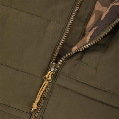 Close-up of the Delta Featherless Down Vest zipper with yellow cord pull, showcasing the camouflaged lining, ideal for lightweight warmth and outdoor versatility.