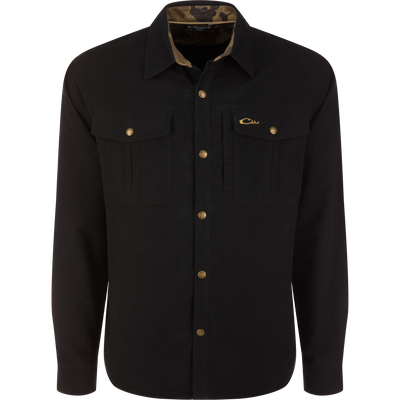 Delta Moleskin Shirt Jacket, black long-sleeved button-up with brass-tone snaps, flap chest pockets, and camouflage-print collar lining, ideal for outdoor and hunting wear.