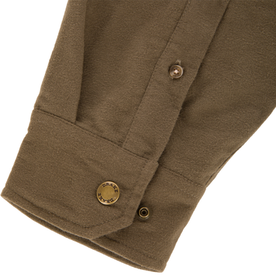 Close-up of Delta Moleskin Shirt Jacket's olive-brown flap pocket with snap closure, showcasing durable, brushed moleskin for rugged outdoor performance and warmth.
