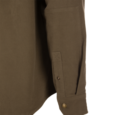 Delta Moleskin Shirt Jacket on hanger, showcasing wool texture, Magnattach™ chest pocket, reinforced forearms, and antique brass snaps, highlighting its rugged, durable design for outdoor use.