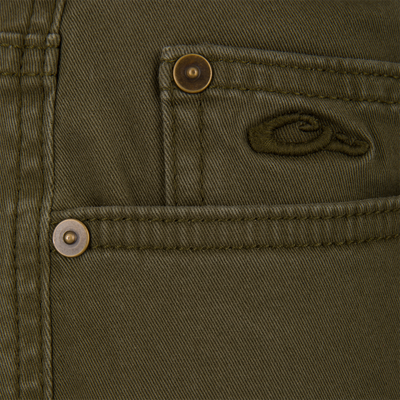 Olive green Lifestyle Wingshooter Twill 5 Pocket Pants with metal pocket rivets and a small embroidered duck logo.