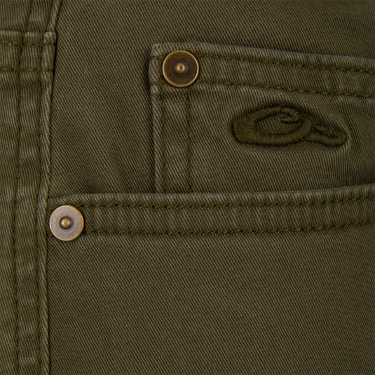 Olive green Lifestyle Wingshooter Twill 5 Pocket Pants with metal pocket rivets and a small embroidered duck logo.