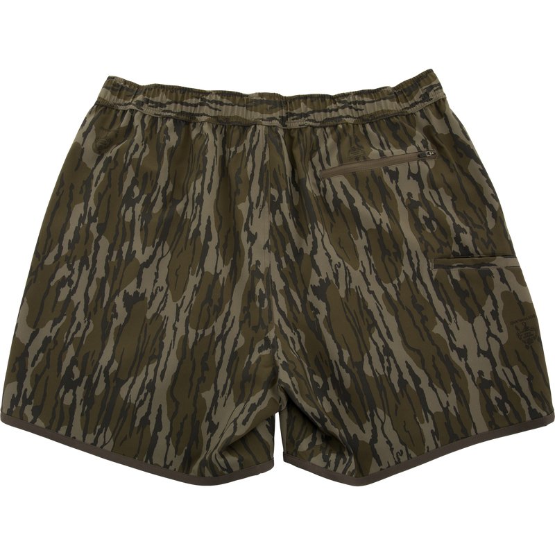 Lake Shore Shorty Short with tiger-stripe camouflage, elastic waistband, zip-up pocket, and brown piping, ideal for water activities and mobility.