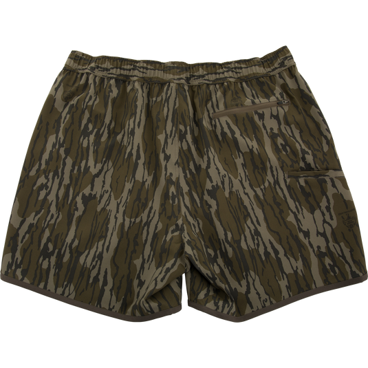 Lake Shore Shorty Short with tiger-stripe camouflage, elastic waistband, zip-up pocket, and brown piping, ideal for water activities and mobility.