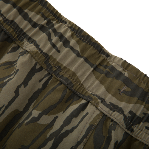 Close-up of Lake Shore Shorty Short's elastic waistband showcasing tiger-stripe camo print, highlighting stitching and fabric texture designed for water activities with style and comfort.