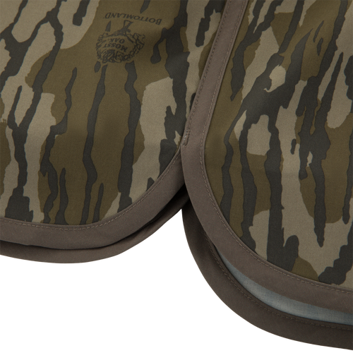 Close-up of Mossy Oak “Bottomland” camouflage fabric pads, resembling the material of Drake Lake Shore Shorty Short, highlighting durability for outdoor water adventures.