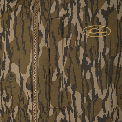 Delta Quilted Vest in a brown and tan camouflage pattern, featuring a quilted, water-resistant design with a front zipper and embroidered Lifestyle logos on the chest.