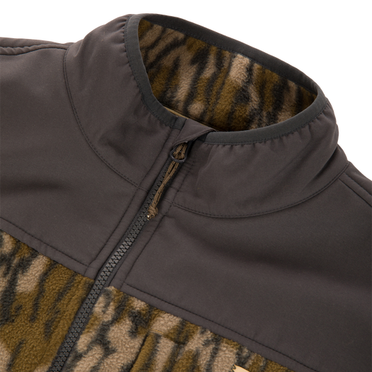 Camp Fleece Over Under Quarter Zip durable outdoor pullover featuring a solid dark shoulder panel and a brown and black animal print pattern on the body.