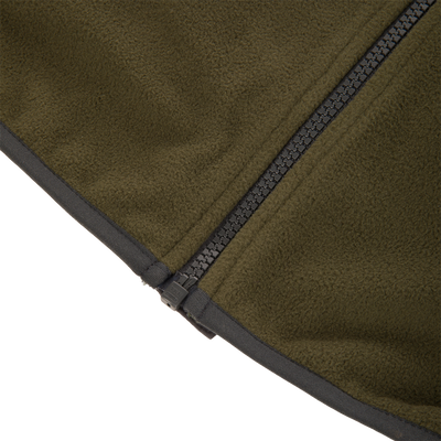 Camp Fleece Vest close-up showing olive-green fleece and chunky black YKK zipper, highlighting the vest's durable, weather-resistant design ideal for outdoor activities.