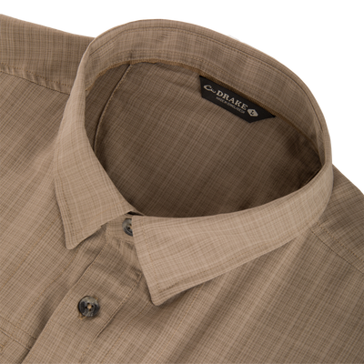 Close-up of the Wingshooter Cross Hatch Shirt showcasing its woven texture, hidden button-down collar, and brand tag, highlighting its lightweight, moisture-wicking, and UPF-protected design.