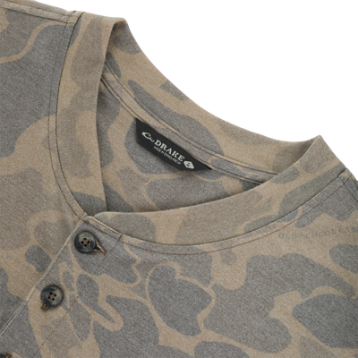 Lightweight, tan and brown camouflage patterned Tri-Blend Henley Over Under shirt with a three-button placket and a neck label.