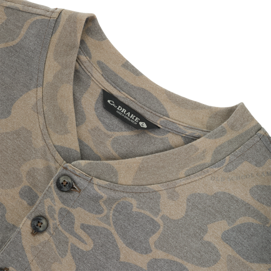 Lightweight, tan and brown camouflage patterned Tri-Blend Henley Over Under shirt with a three-button placket and a neck label.