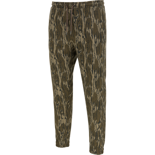 Lifestyle Three End Cargo Sweat Pant in Mossy Oak Original Bottomland camouflage, featuring midweight fabric with stretch technology, an elastic drawstring waist, and cuffed hems.