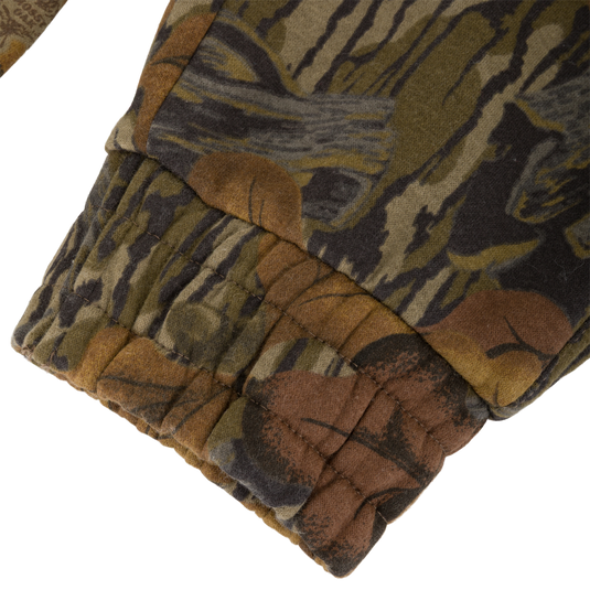 Close-up of a brown and green camouflage Three End Cargo Sweat Pant leg with a gathered elastic cuff.