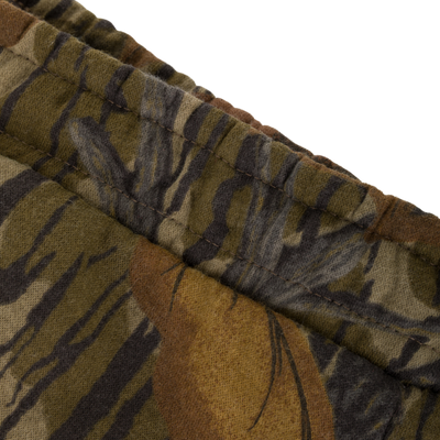 Close-up of an elasticized waistband on midweight, camouflage-patterned Three End Cargo Sweat Pant.