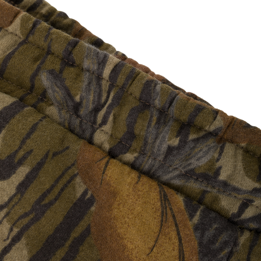 Close-up of an elasticized waistband on midweight, camouflage-patterned Three End Cargo Sweat Pant.