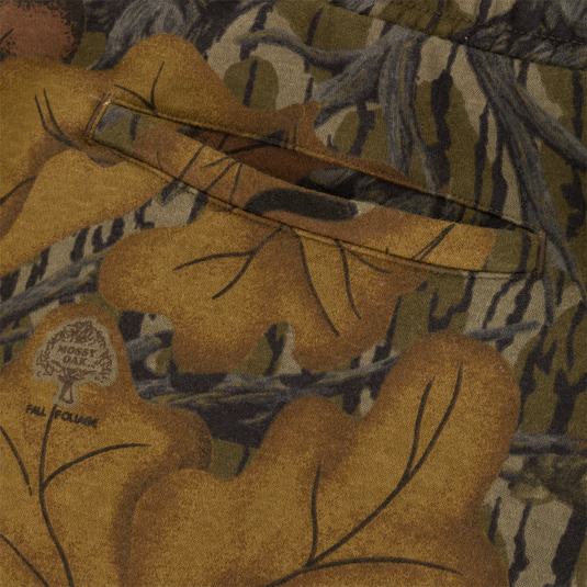 Close-up of Three End Cargo Sweat Pant in midweight camouflage, featuring a welt pocket and a printed logo of a tree above the text Fall Foliage.