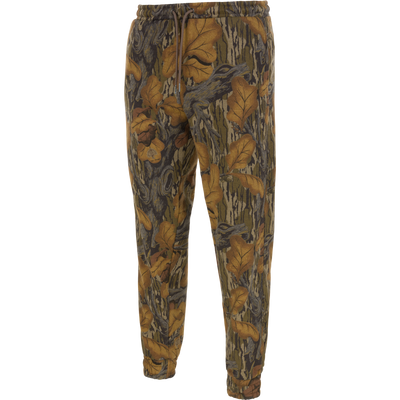 Three End Cargo Sweat Pant in Mossy Oak Fall Foliage, featuring a midweight design with a fall leaf and tree bark camouflage print, a drawstring waist, and elastic cuffs.