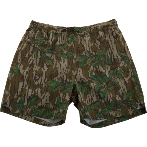 Lake Shore Dock Short featuring a camouflage pattern with green leaves, elastic waistband, drawstring, mesh-lined pockets, and zippered side pocket, ideal for water activities.
