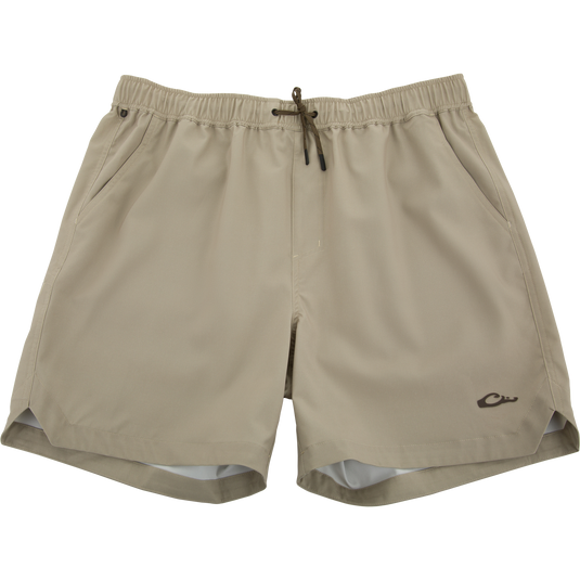 Lake Shore Dock Short with elastic waistband, drawstring, angled pockets, and a small logo, designed for comfort and movement with water-repellent fabric.
