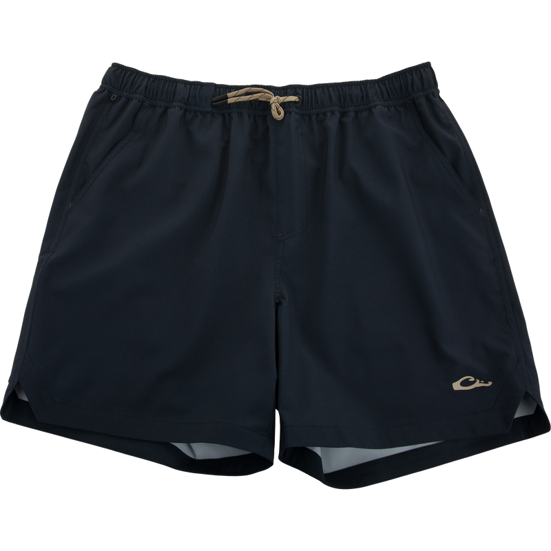 Lake Shore Dock Short with elastic waistband, drawstring, side pockets, and logo on hem, designed for lightweight comfort and water resistance.