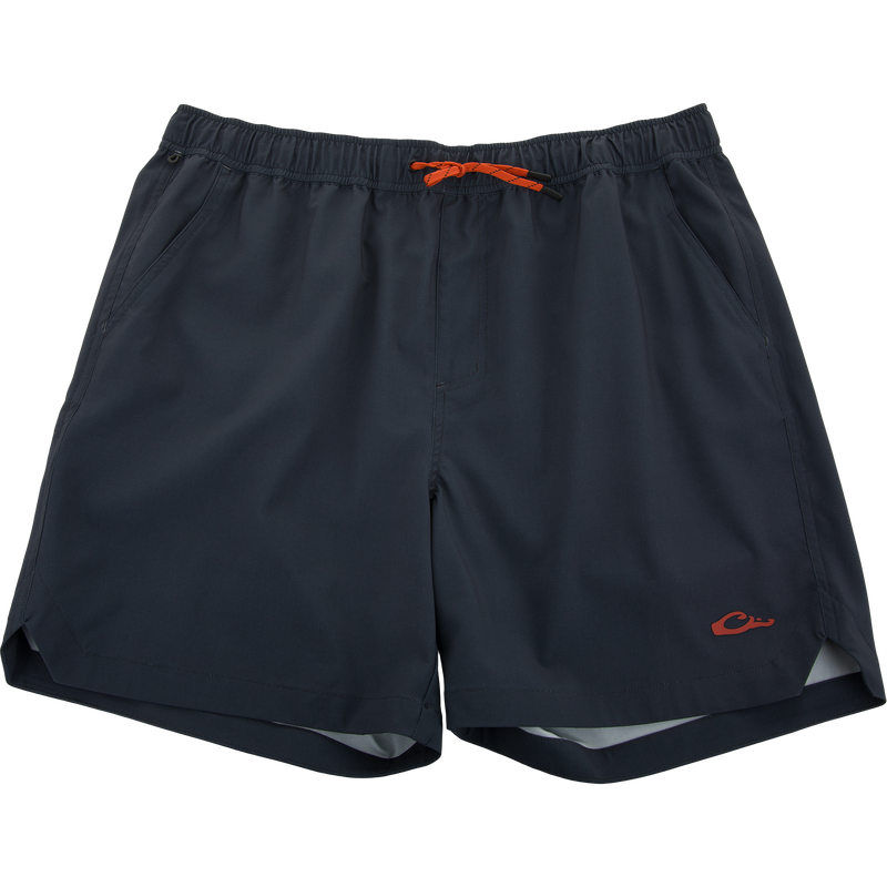 Lake Shore Dock Short, navy blue with an orange draw-cord, features breathable fabric, elastic waistband, mesh-lined pockets, and water-repellent finish for outdoor comfort.