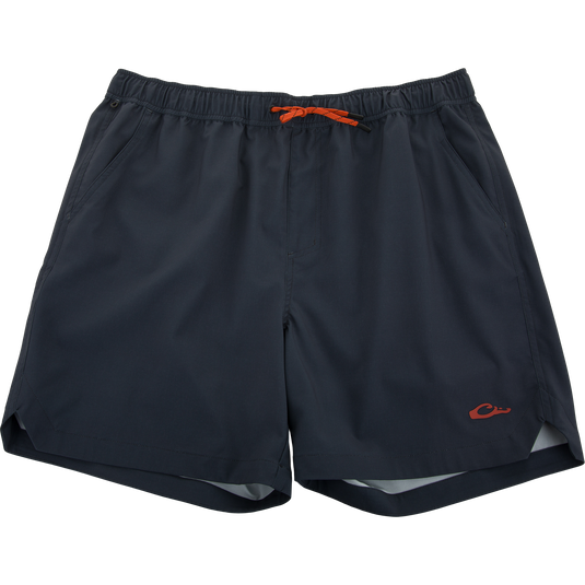 Lake Shore Dock Short, navy blue with an orange draw-cord, features breathable fabric, elastic waistband, mesh-lined pockets, and water-repellent finish for outdoor comfort.