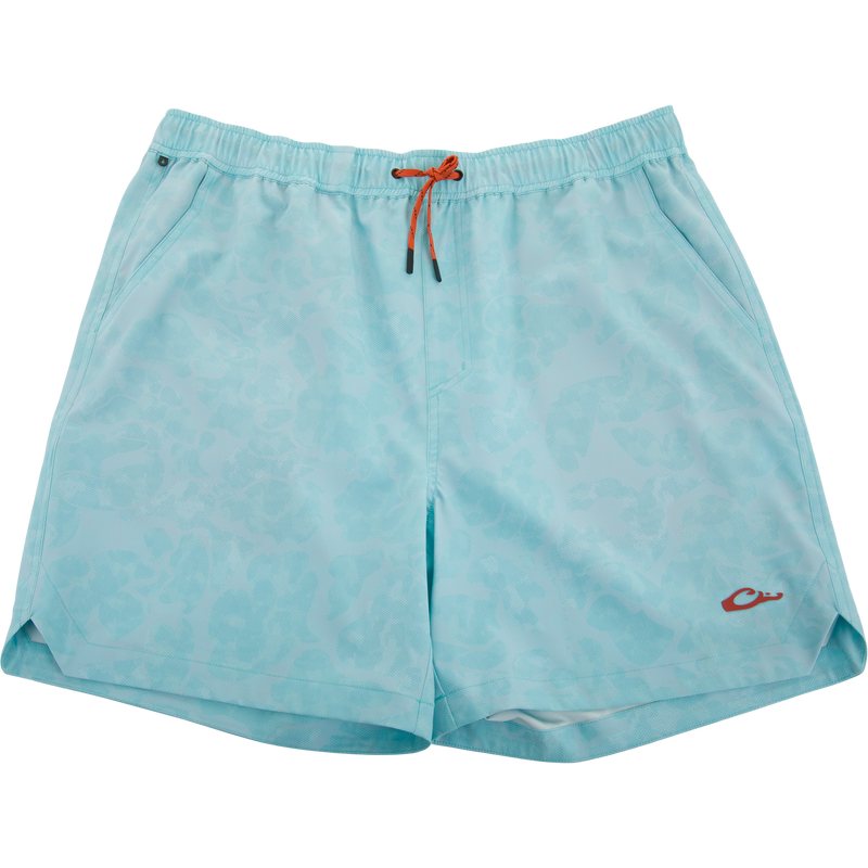 Lake Shore Dock Short with elastic waistband, orange drawcord, side pockets, and subtle animal-print pattern, designed for comfort and water-repellency.