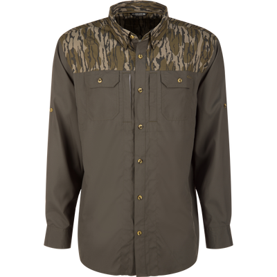 Wingshooter Trey Shirt with camo yokes and solid olive body, featuring chest pockets, roll-up sleeves, and vented back, designed for comfort and performance in warm conditions.