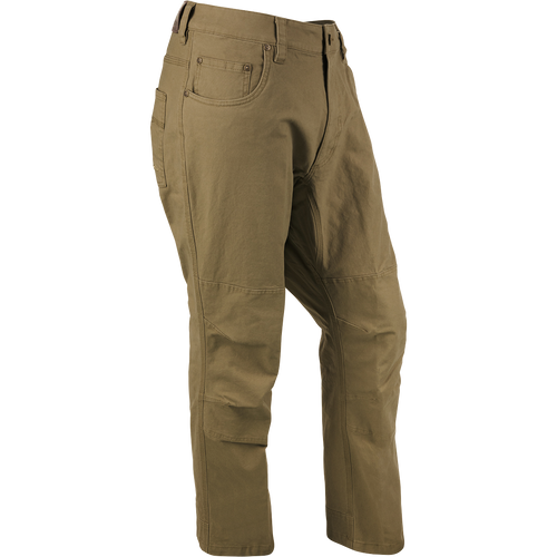A pair of Canvas Pants made from lightweight, garment-washed cotton canvas with reinforced knees and metal rivet accents on the pockets.