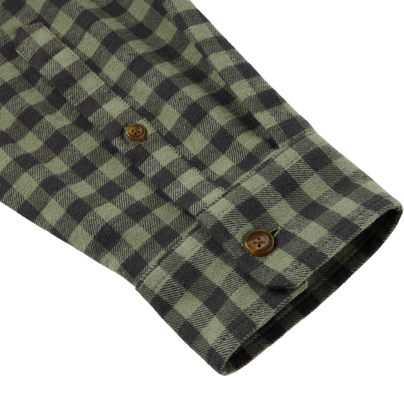 Close-up of the Autumn Flannel Shirt sleeve, highlighting the green-and-black checkered pattern, brown buttons, and brushed cotton twill texture with spandex for flexibility.